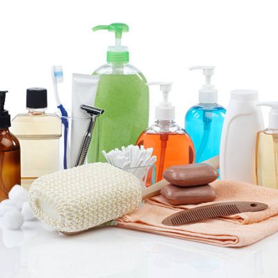 assorted personal hygiene products on white background